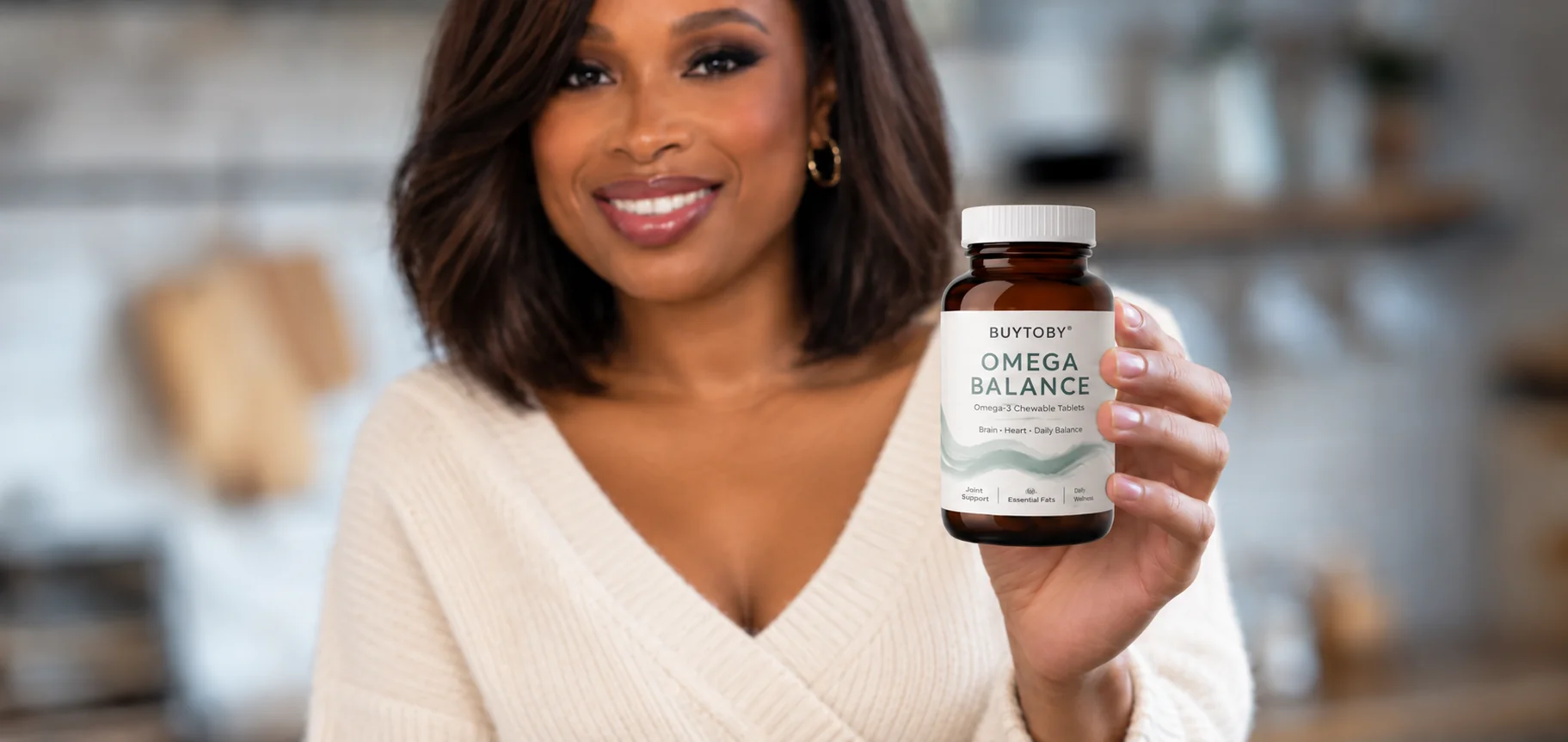 Jennifer Hudson holding a bottle of BuyToBy Omega Balance